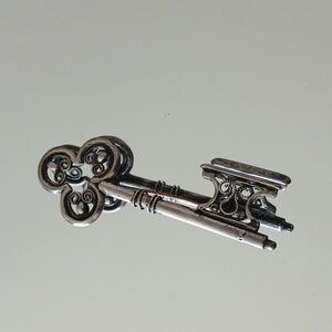 Elegant Silver Tone Key Pendant